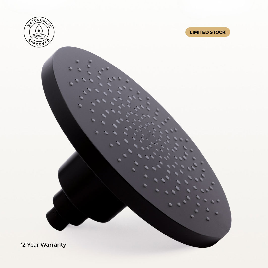 Black filtered shower head with 'Limited Stock' and '2 Year Warranty' text on a white background