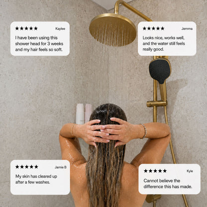 Person using a filtered shower head with customer reviews displayed.